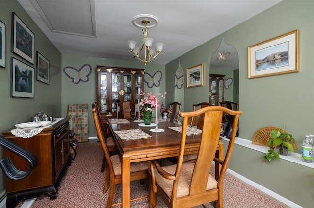 30 Nims Ave, West Babylon, NY 11704 - carpeted dining area featuring baseboards and a chandelier
