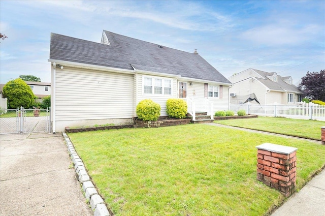 30 Nims Ave, West Babylon, NY 11704 - cape cod home featuring a gate