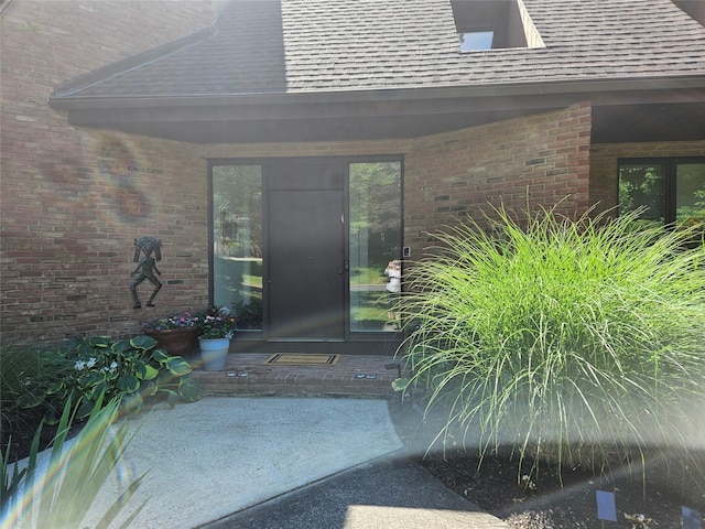 5 Sophia St, Monsey, NY 10952 - property entrance featuring a shingled roof and brick siding