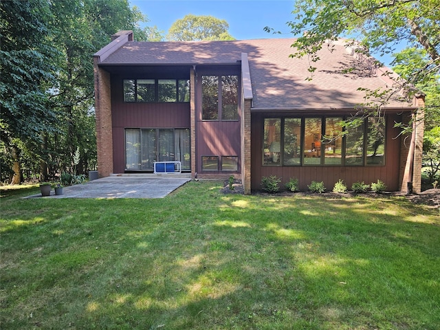 5 Sophia St, Monsey, NY 10952 - back of house featuring a patio, a yard, and a shingled roof