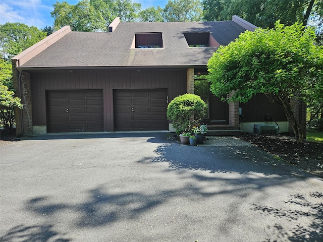 5 Sophia St, Monsey, NY 10952 - view of front of property with driveway, an attached garage, and a shingled roof