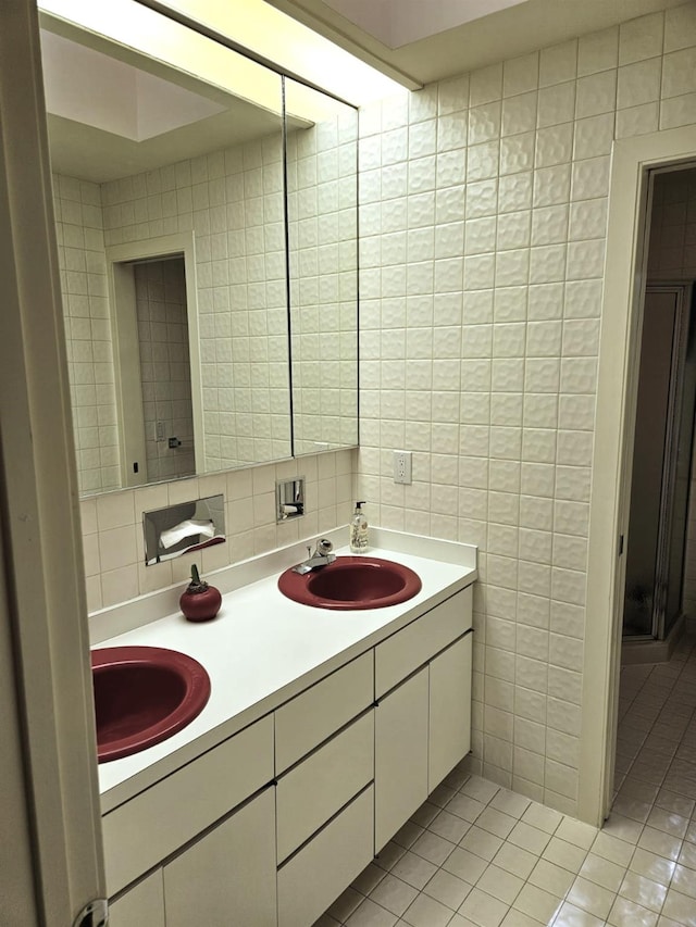 5 Sophia St, Monsey, NY 10952 - bathroom with tile walls, double vanity, tile patterned floors, and backsplash