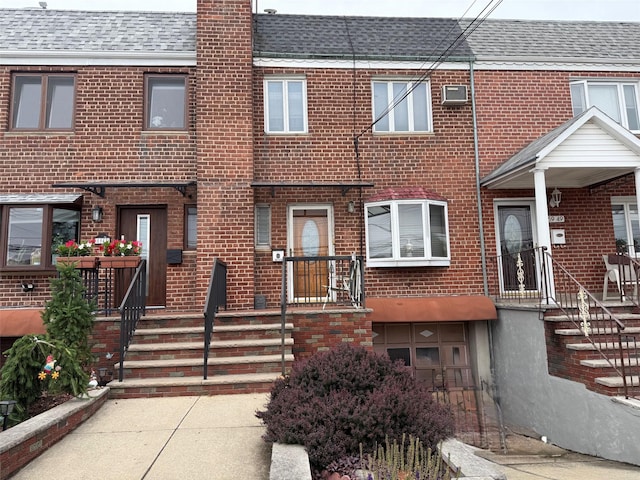59-47 69th Ln Unit A, Maspeth, NY 11378 - townhome / multi-family property with brick siding, roof with shingles, and a chimney