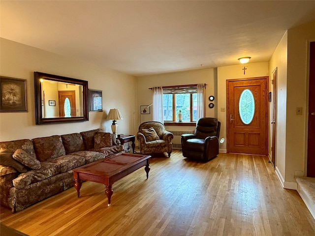 59-47 69th Ln Unit A, Maspeth, NY 11378 - living room with wood finished floors and radiator
