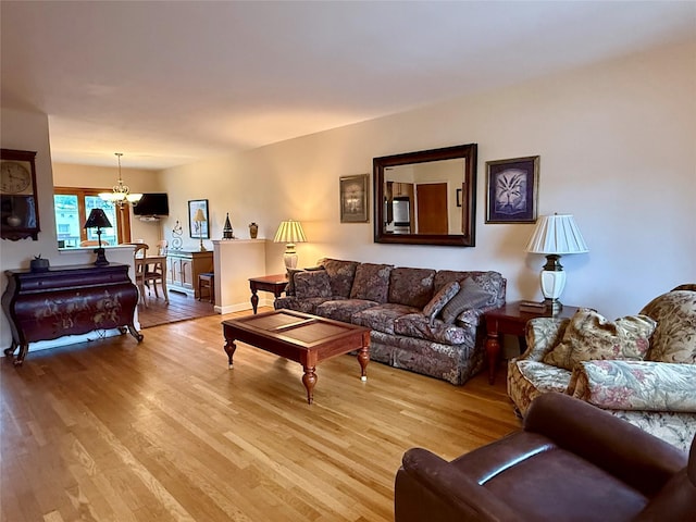 59-47 69th Ln Unit A, Maspeth, NY 11378 - living area featuring light wood-type flooring and a chandelier