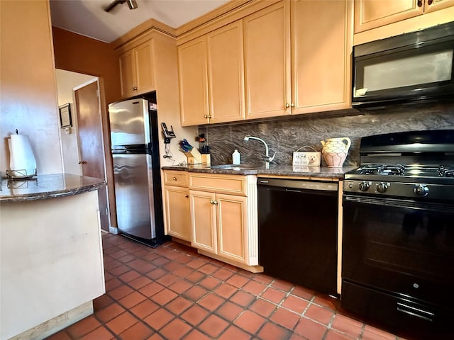 59-47 69th Ln Unit A, Maspeth, NY 11378 - kitchen featuring black appliances, tasteful backsplash, dark tile patterned floors, and dark stone countertops