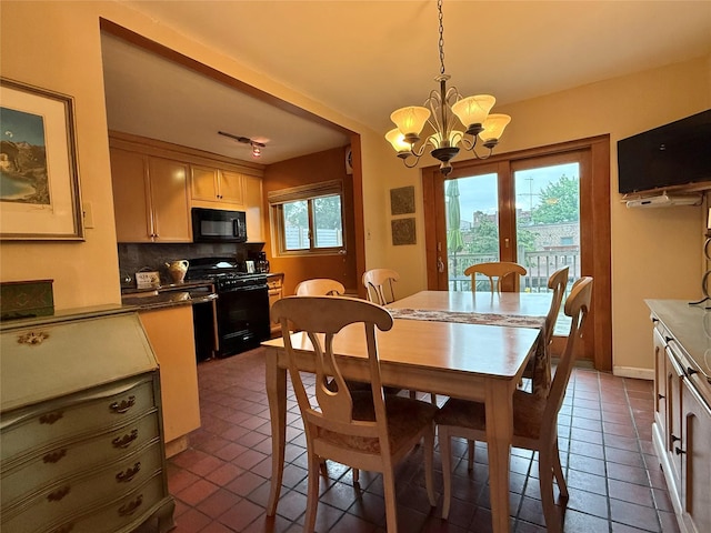 59-47 69th Ln Unit A, Maspeth, NY 11378 - dining room with a chandelier and dark tile patterned floors