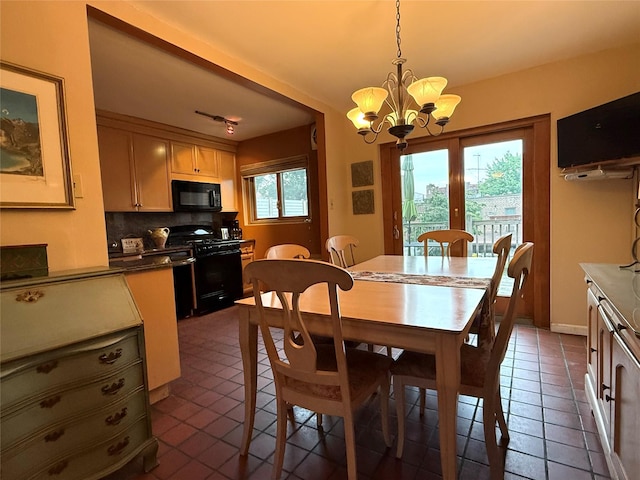 59-47 69th Ln Unit A, Maspeth, NY 11378 - dining area with a chandelier and dark tile patterned floors