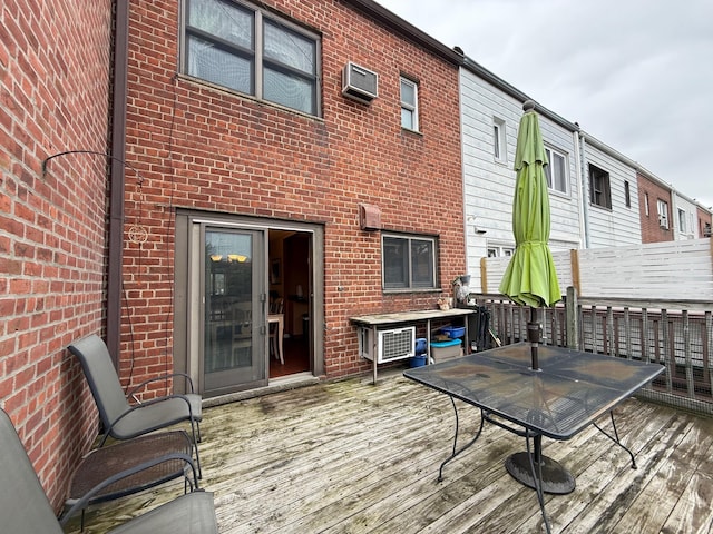 59-47 69th Ln Unit A, Maspeth, NY 11378 - wooden deck with outdoor dining area and a wall mounted AC