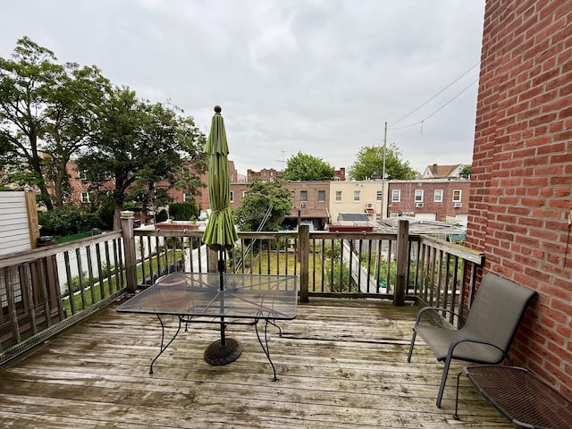 59-47 69th Ln Unit A, Maspeth, NY 11378 - wooden terrace with outdoor dining space