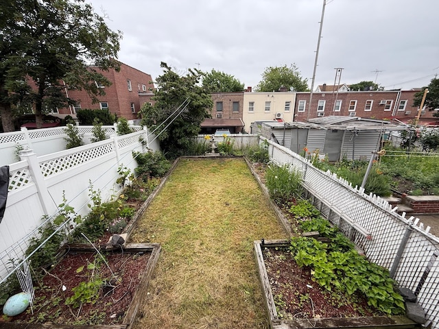 59-47 69th Ln Unit A, Maspeth, NY 11378 - fenced backyard featuring a garden