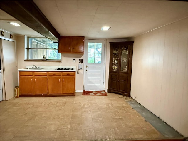 59-47 69th Ln Unit A, Maspeth, NY 11378 - kitchen featuring light floors, light countertops, and brown cabinetry
