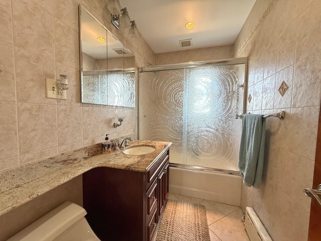 59-47 69th Ln Unit A, Maspeth, NY 11378 - full bath with tile walls, vanity, enclosed tub / shower combo, and tile patterned floors