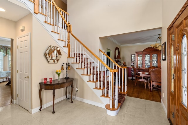 248 Delaware Ave, Island Park, NY 11558 - foyer entrance featuring stairway, ornamental molding, light tile patterned floors, a towering ceiling, and recessed lighting