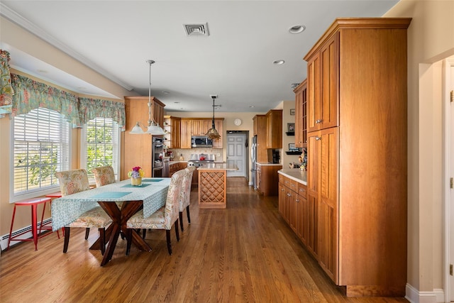 248 Delaware Ave, Island Park, NY 11558 - dining space featuring wood finished floors and recessed lighting