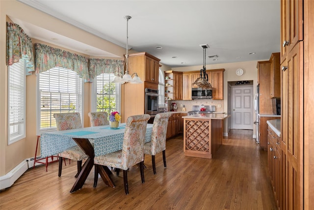 248 Delaware Ave, Island Park, NY 11558 - dining space with wood finished floors and recessed lighting