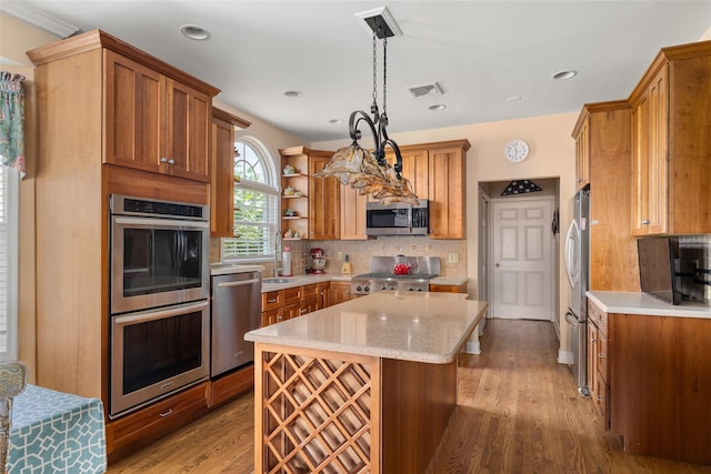 248 Delaware Ave, Island Park, NY 11558 - kitchen with stainless steel appliances, open shelves, brown cabinetry, tasteful backsplash, and recessed lighting