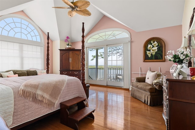 248 Delaware Ave, Island Park, NY 11558 - bedroom featuring access to exterior, light wood finished floors, high vaulted ceiling, and a water view