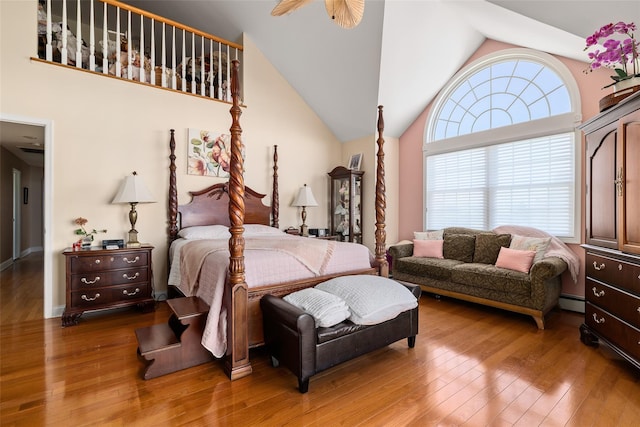 248 Delaware Ave, Island Park, NY 11558 - bedroom with wood finished floors, vaulted ceiling, and a baseboard radiator