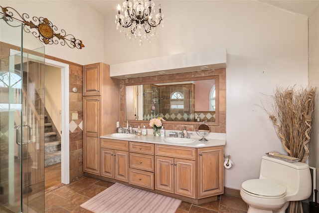 248 Delaware Ave, Island Park, NY 11558 - full bath with double vanity, a shower stall, a chandelier, and a high ceiling
