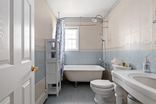 248 Delaware Ave, Island Park, NY 11558 - bathroom featuring tile walls, a baseboard radiator, and tile patterned floors