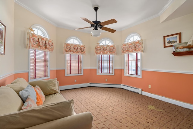 248 Delaware Ave, Island Park, NY 11558 - carpeted living area featuring crown molding, a ceiling fan, and a baseboard heating unit