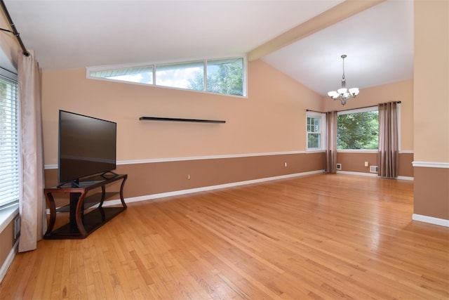 38 Balmoral Cres, White Plains, NY 10607 - unfurnished living room with light wood-style floors and a chandelier