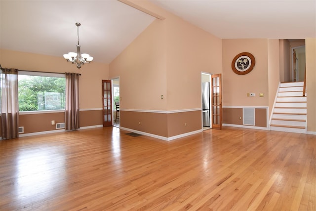 38 Balmoral Cres, White Plains, NY 10607 - unfurnished living room featuring a chandelier, high vaulted ceiling, light wood finished floors, and stairs