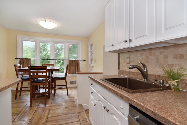 38 Balmoral Cres, White Plains, NY 10607 - kitchen with tasteful backsplash, dishwasher, and white cabinets