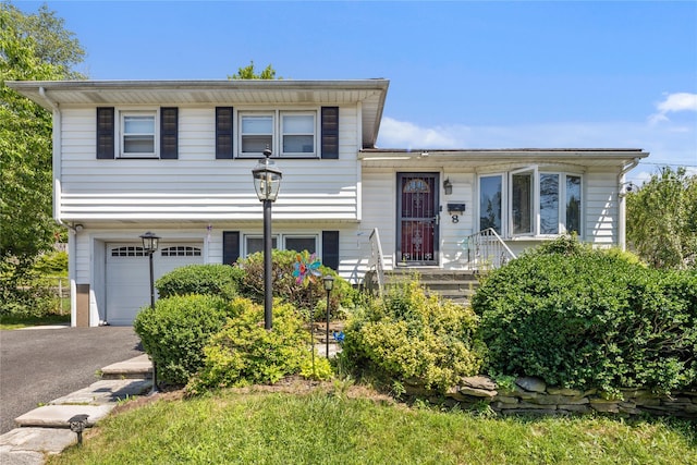 8 Valley View Ter, Suffern, NY 10901 - tri-level home featuring a garage and asphalt driveway