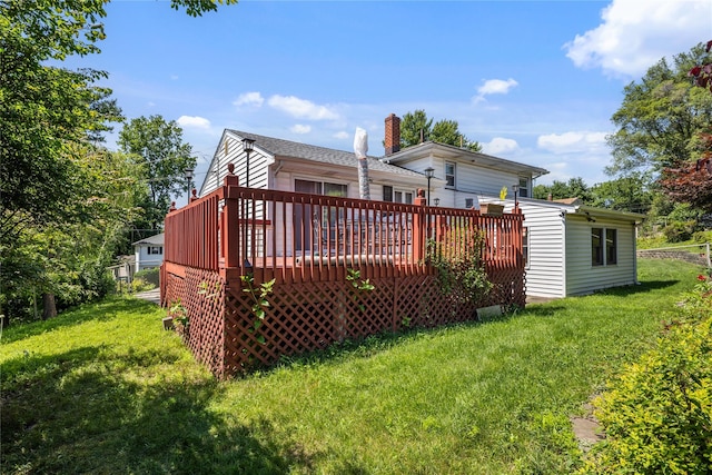 8 Valley View Ter, Suffern, NY 10901 - back of property with a wooden deck, a yard, a chimney, and a garage