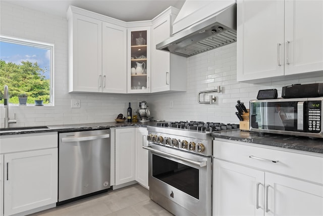 166 Williams Way S, Baiting Hollow, NY 11933 - kitchen with stainless steel appliances, wall chimney range hood, decorative backsplash, and white cabinets