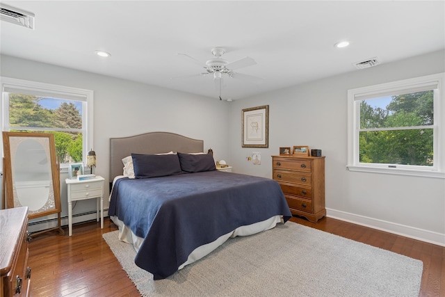 166 Williams Way S, Baiting Hollow, NY 11933 - bedroom with a baseboard radiator, multiple windows, hardwood / wood-style floors, recessed lighting, and a ceiling fan