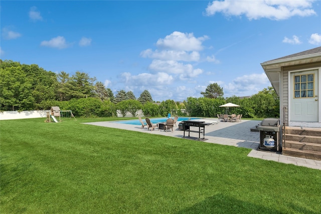 166 Williams Way S, Baiting Hollow, NY 11933 - view of grassy yard with a patio, a playground, and an outdoor pool