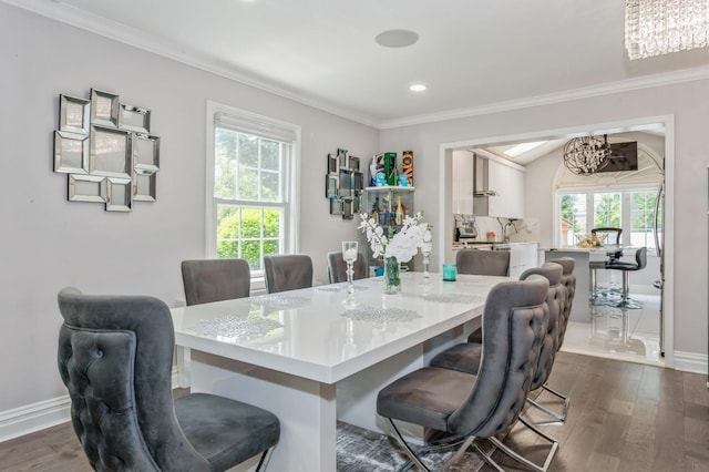 1 Howland Rd, East Rockaway, NY 11518 - dining space with a chandelier, crown molding, healthy amount of natural light, dark wood-type flooring, and recessed lighting
