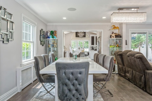 1 Howland Rd, East Rockaway, NY 11518 - dining area with a chandelier, dark wood-type flooring, crown molding, and recessed lighting