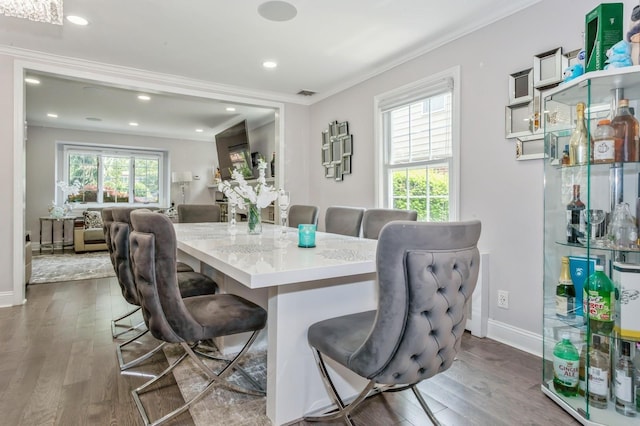1 Howland Rd, East Rockaway, NY 11518 - dining space with ornamental molding, dark wood-type flooring, and recessed lighting