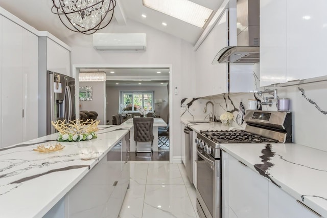1 Howland Rd, East Rockaway, NY 11518 - kitchen with wall chimney range hood, appliances with stainless steel finishes, a wall mounted air conditioner, white cabinetry, and recessed lighting