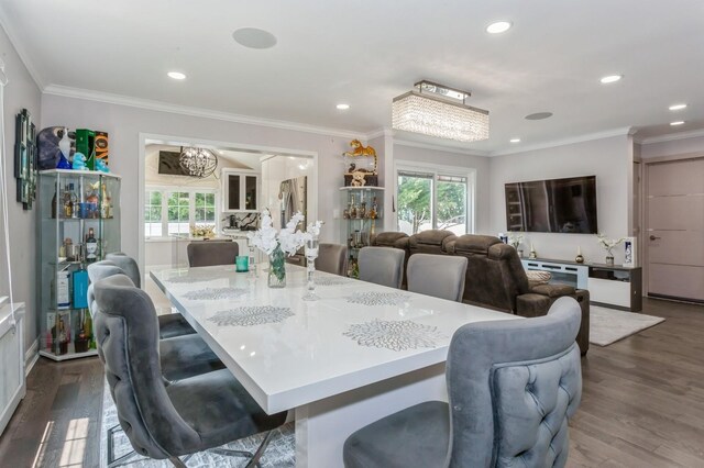 1 Howland Rd, East Rockaway, NY 11518 - dining space with plenty of natural light, dark wood-style flooring, crown molding, and recessed lighting