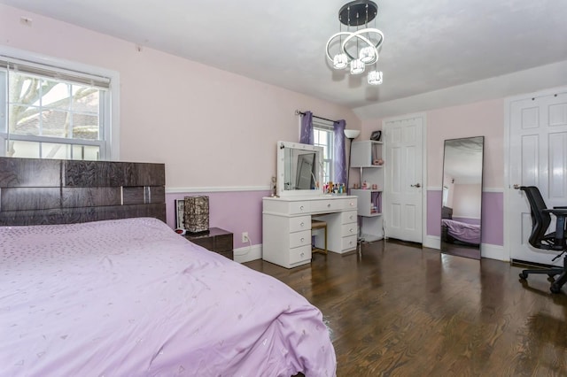 1 Howland Rd, East Rockaway, NY 11518 - bedroom with wood finished floors and a chandelier