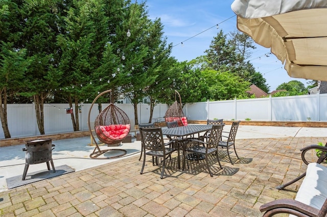 1 Howland Rd, East Rockaway, NY 11518 - fenced backyard featuring outdoor dining area and a patio area