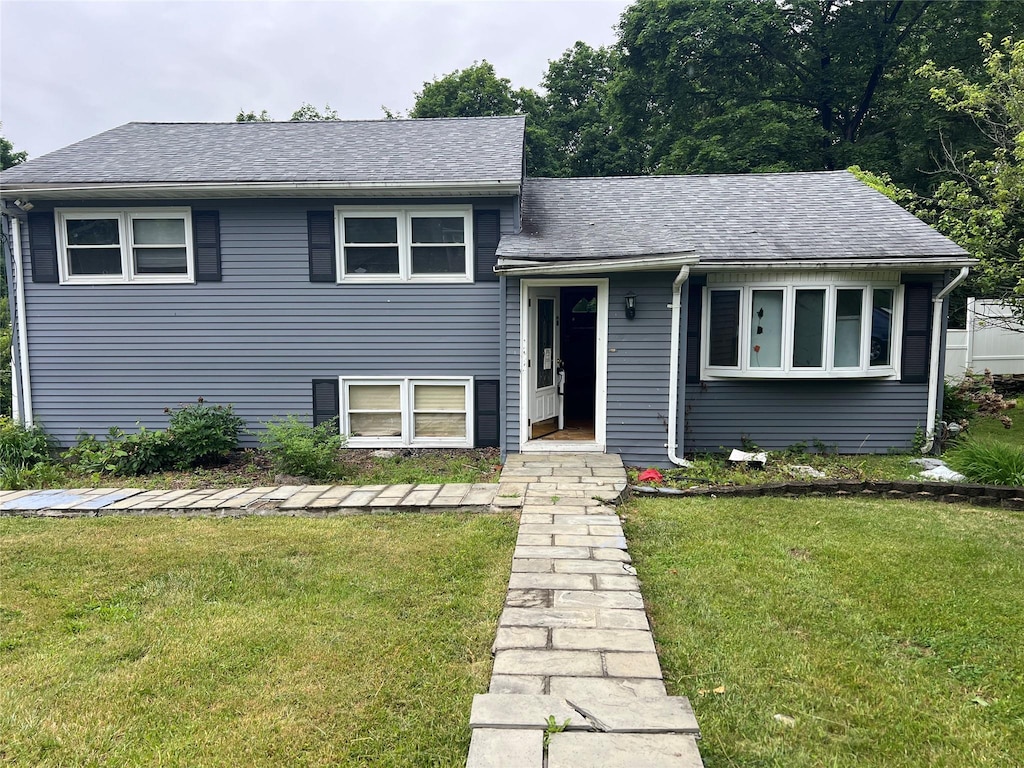 22 Oriole Dr, Poughkeepsie, NY 12601 - split level home featuring a front yard and a shingled roof