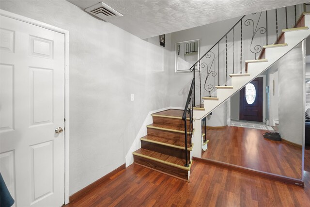 114 Cone Ave, Central Islip, NY 11722 - stairway featuring wood finished floors and baseboards
