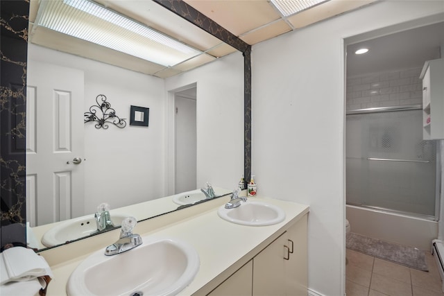 114 Cone Ave, Central Islip, NY 11722 - full bath featuring double vanity, tile patterned flooring, combined bath / shower with glass door, a baseboard heating unit, and recessed lighting