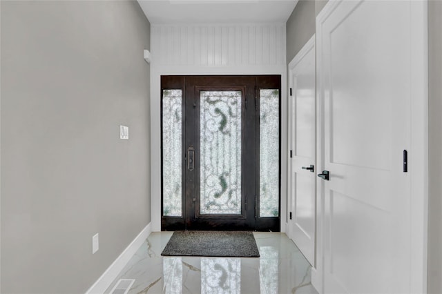 10 Locust St, Hicksville, NY 11801 - foyer with light marble finish flooring and healthy amount of natural light