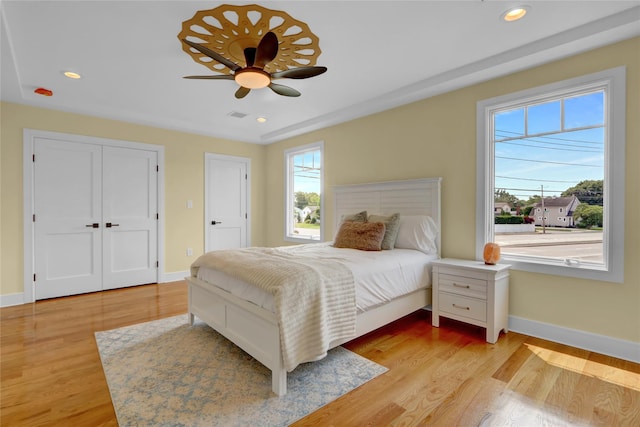 10 Locust St, Hicksville, NY 11801 - bedroom with light wood-style floors, recessed lighting, and a ceiling fan