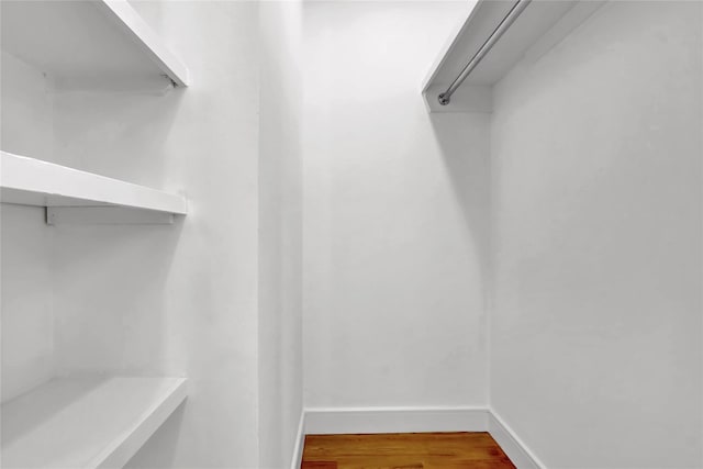 10 Locust St, Hicksville, NY 11801 - walk in closet featuring wood finished floors