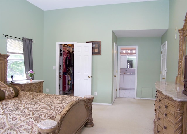54 Gatelot Ave, Lake Ronkonkoma, NY 11779 - bedroom with a walk in closet, light carpet, a closet, and connected bathroom