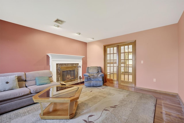 561 Toleman Rd, Rock Tavern, NY 12575 - living room with wood finished floors, a fireplace, and french doors