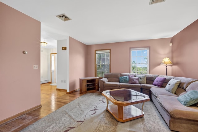 561 Toleman Rd, Rock Tavern, NY 12575 - living area featuring wood finished floors and a baseboard radiator